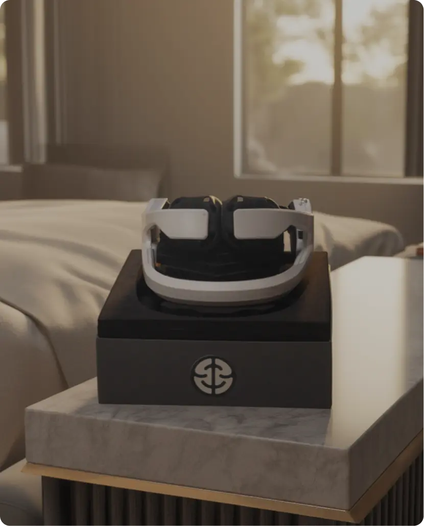 The ease headset resting on its case beside a bed